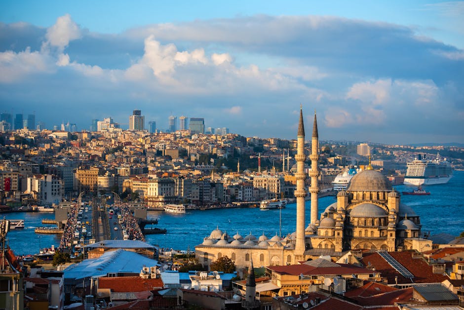 A breathtaking view of Istanbul featuring the Bosphorus and New Mosque at sunset.
