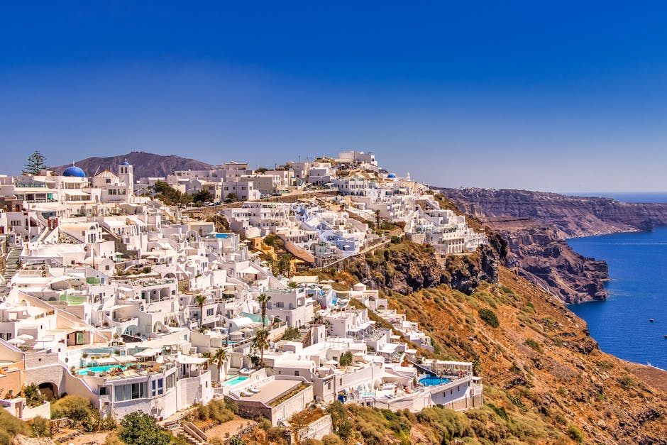 A breathtaking view of Santorini's iconic whitewashed buildings against a vibrant blue sea.