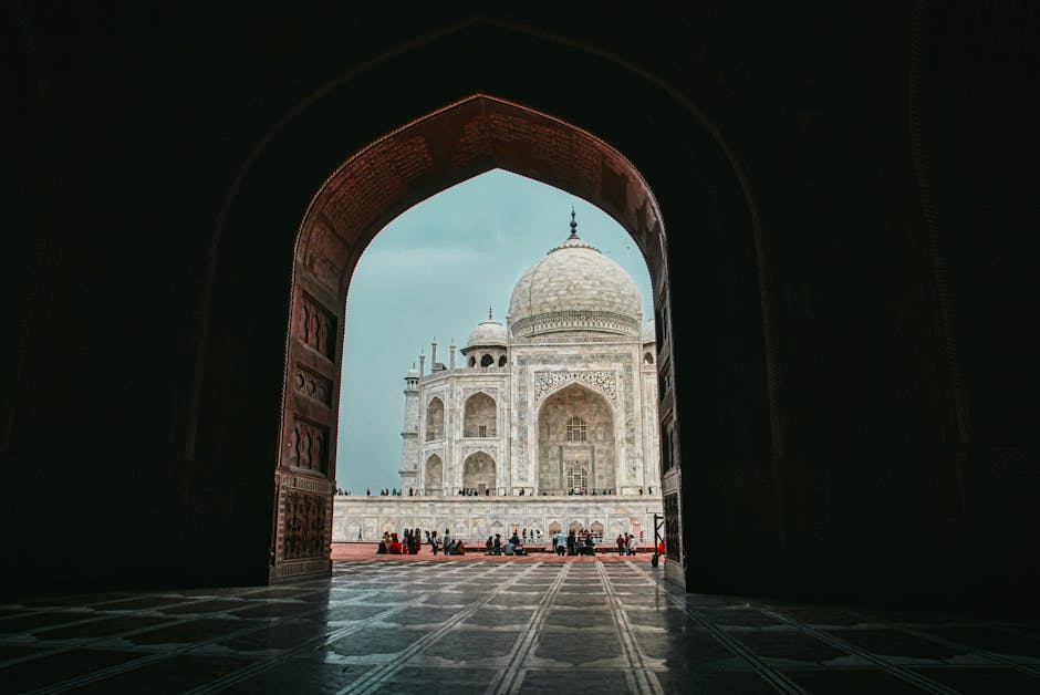 Low angle view from arched entrance on mausoleum mosque Taj Mahal in India