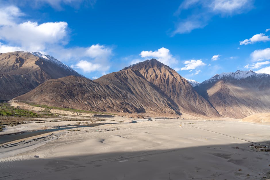 A breathtaking view of the mountain range in Leh, India under a clear blue sky.