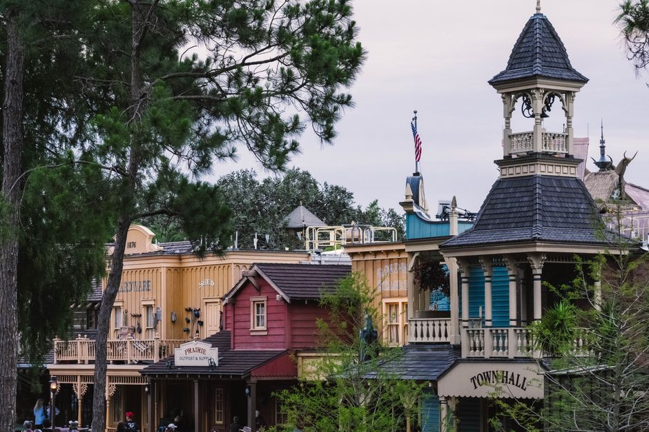 Scenic view of colorful western-style buildings with lush greenery in Florida.