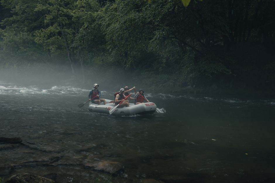 Exciting rafting adventure on a foggy river in Gatlinburg, Tennessee, ideal for travel and lifestyle photography.