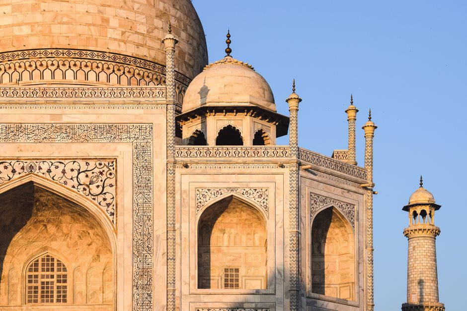 Detailed view of Taj Mahal's intricate architecture in Agra, India during the day.
