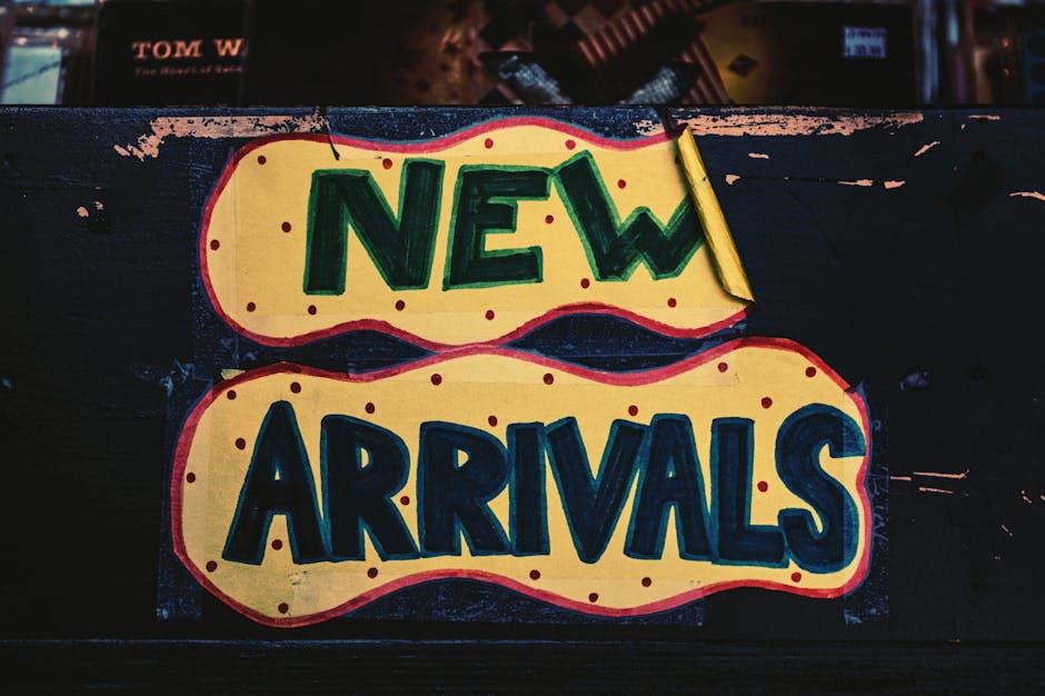 A vibrant handmade 'New Arrivals' sign with bold colors, displayed in a Los Angeles store.