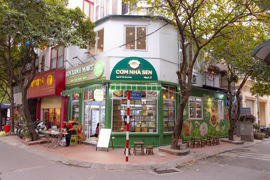 Charming corner of Vietnamese street with eateries and market shops