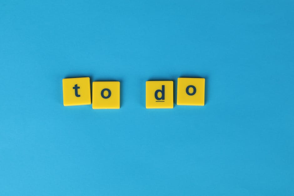 Yellow letter tiles spelling 'to do' against a vibrant blue background for organizational themes.